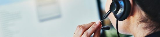 Rearview shot of a young woman working in a call centre